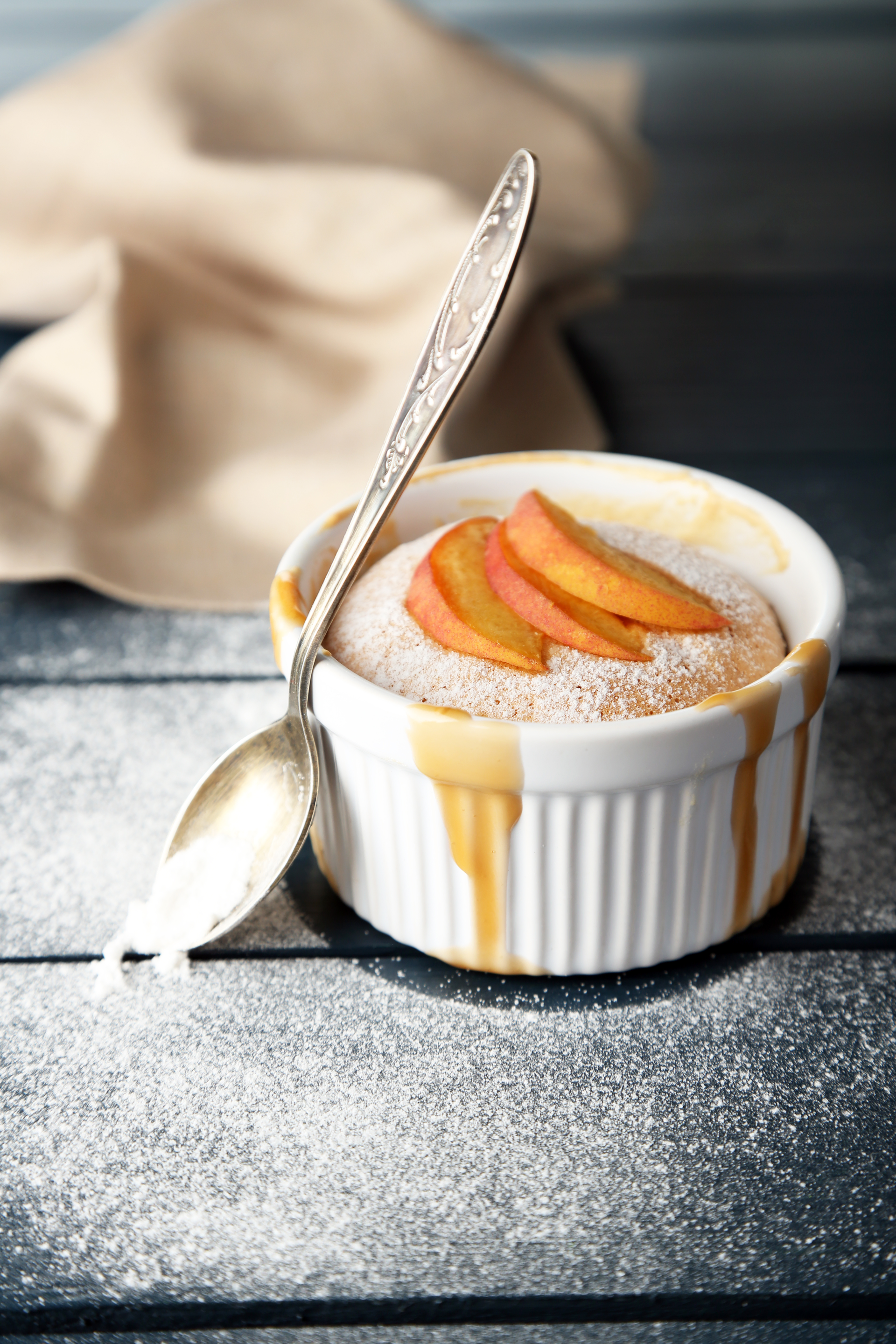 Overhead flat-lay of all ingredients for Velvety French Pot de Crème with Caramel Sauce laid out on a kitchen surface.