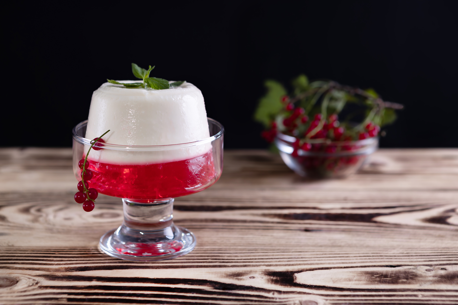 Overhead flat-lay of all ingredients for Velvety Jamaican Sorrel Panna Cotta with Ginger Syrup laid out on a kitchen surface.