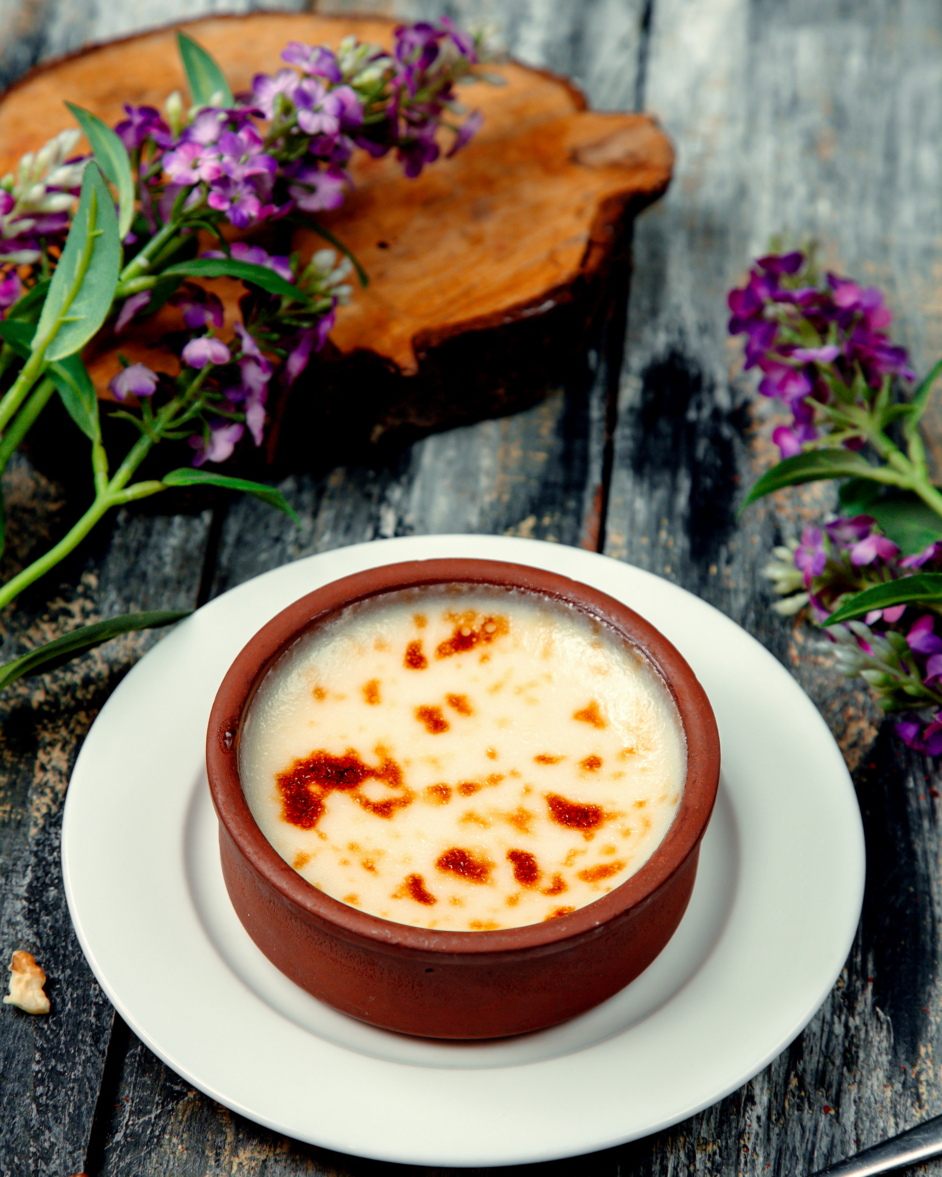 Overhead flat-lay of all ingredients for Velvety Turkish Salep Pudding laid out on a kitchen surface.