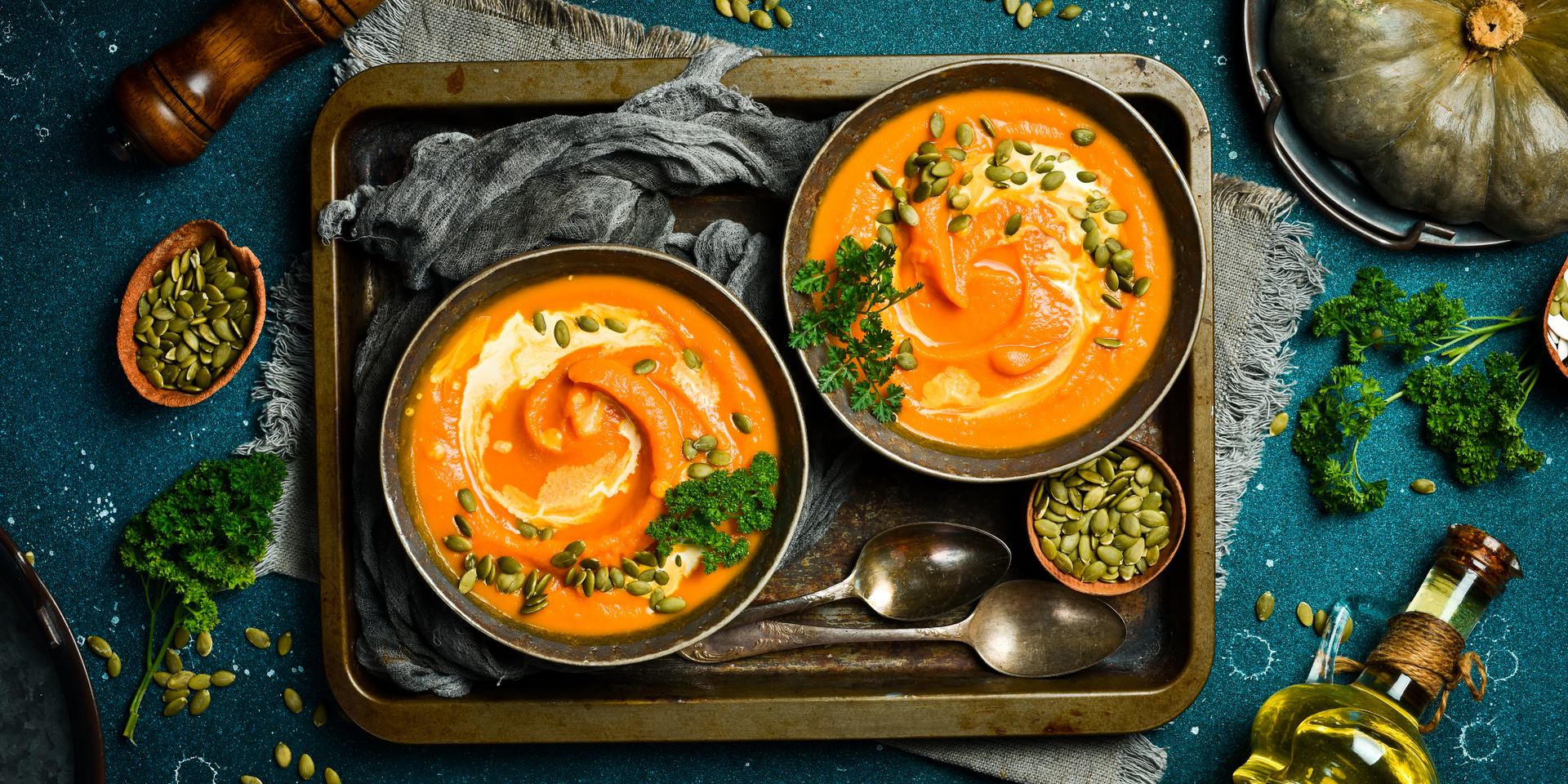 Overhead flat-lay of all ingredients for Vibrant Moroccan Za'atar Spiced Pumpkin Soup laid out on a kitchen surface.