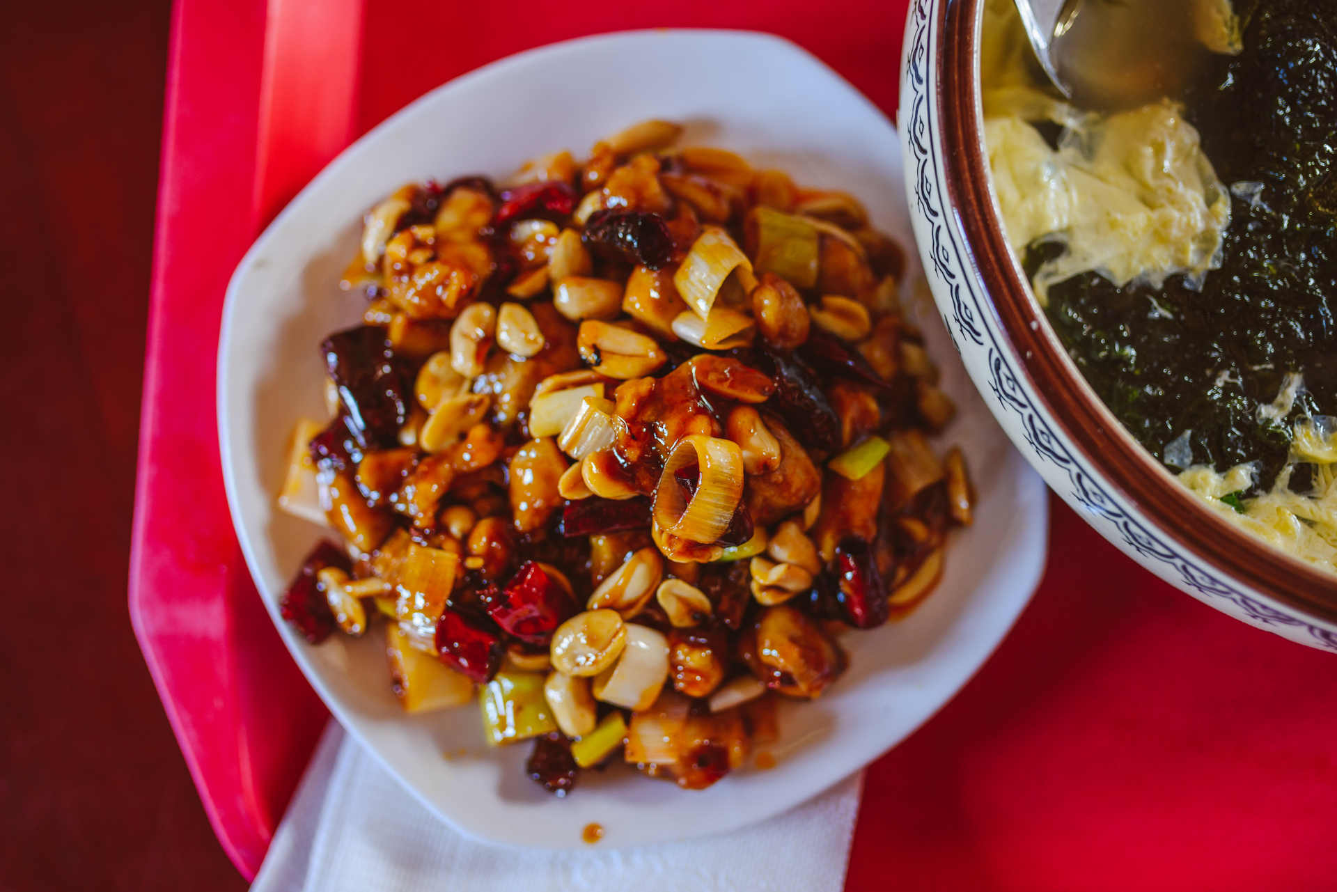 Overhead flat-lay of all ingredients for Vibrant South African Bunny Chow with Spicy Beans laid out on a kitchen surface.
