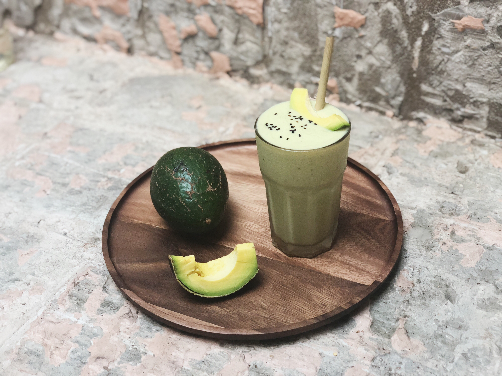 Overhead flat-lay of all ingredients for Vietnamese Avocado Coffee Smoothie laid out on a kitchen surface.