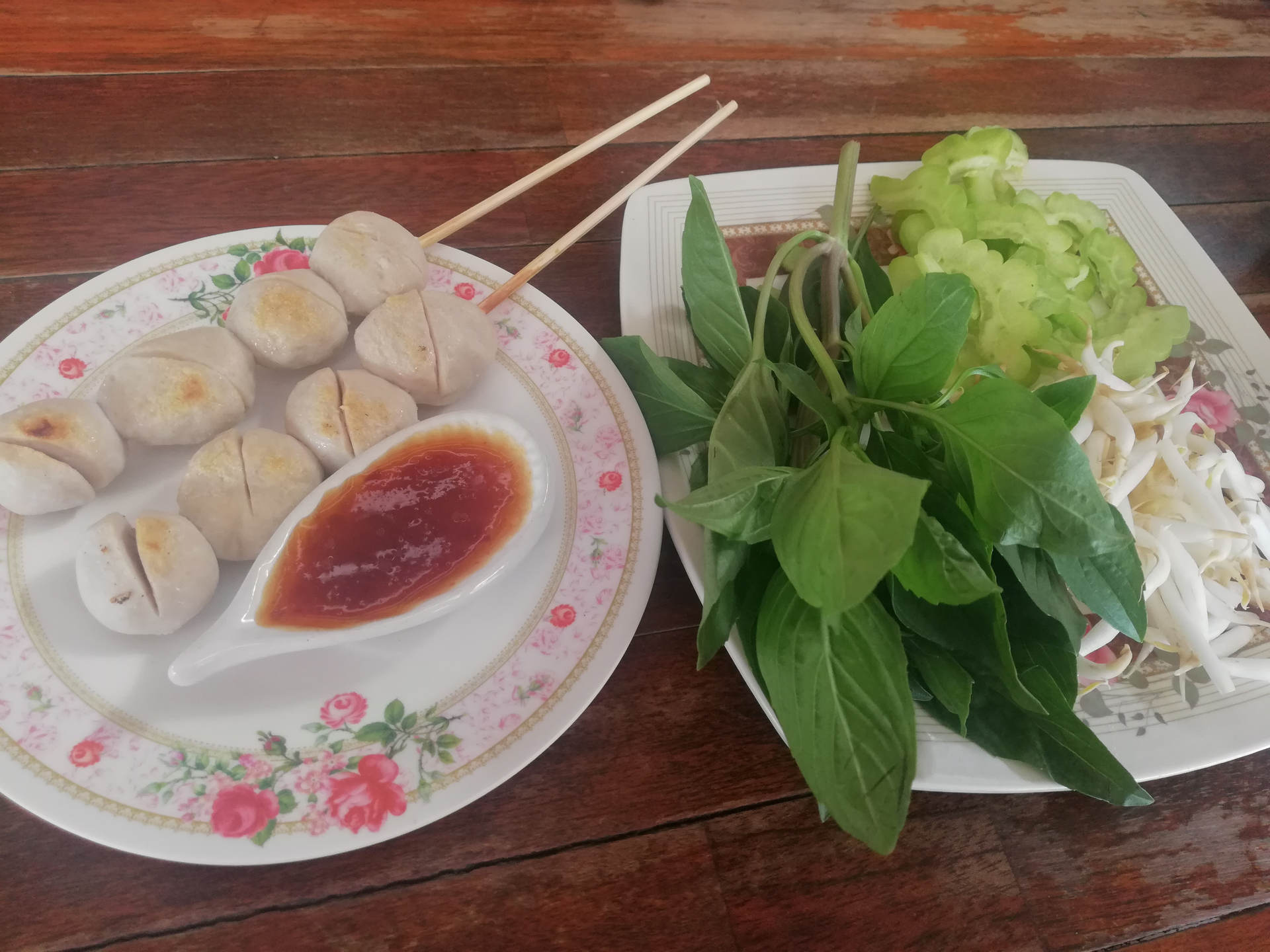 Overhead flat-lay of all ingredients for Vietnamese Dumplings with Nuoc Cham Dipping Sauce laid out on a kitchen surface.