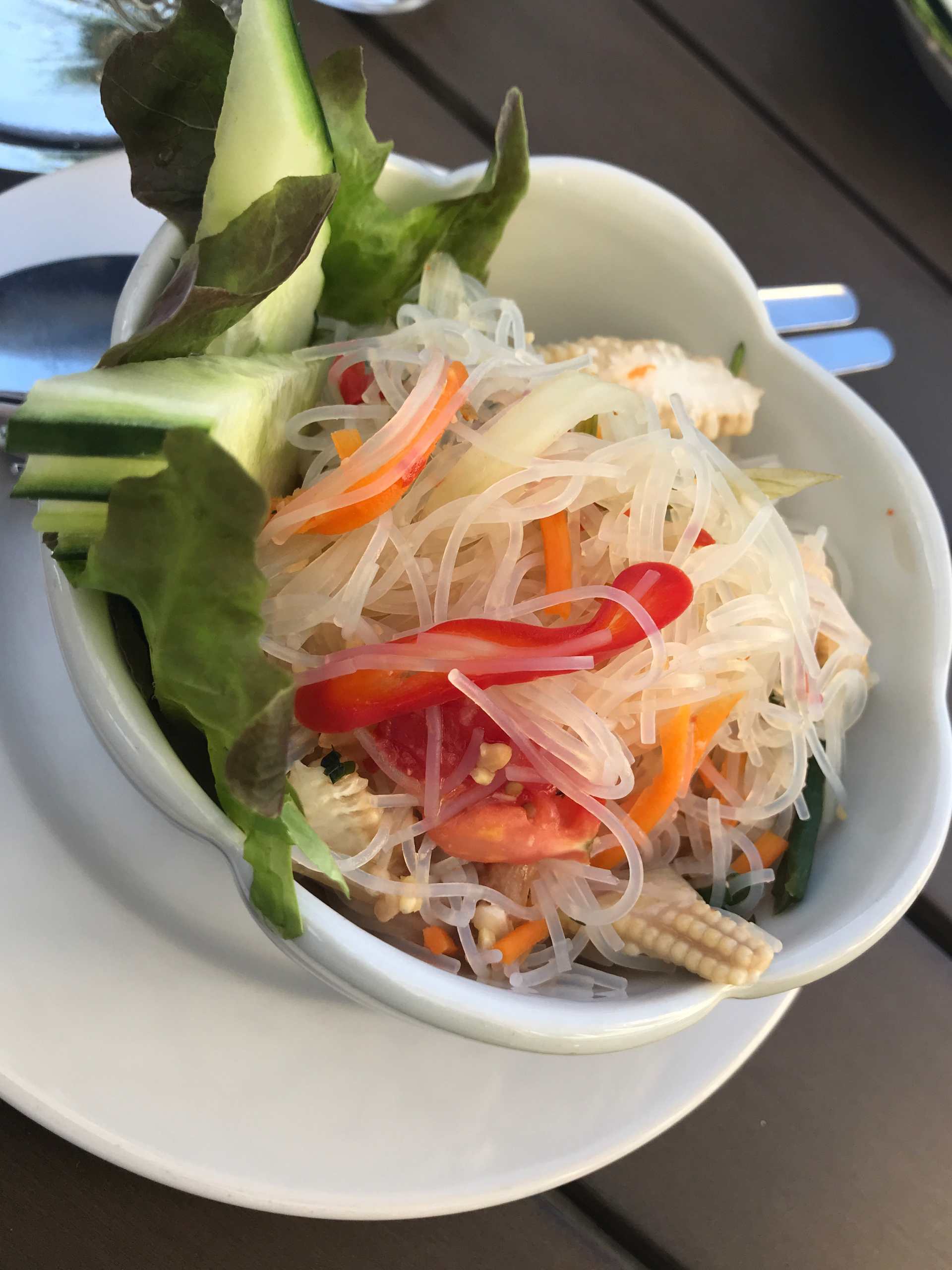Overhead flat-lay of all ingredients for Vietnamese Glass Noodle Salad with Lime and Peanuts laid out on a kitchen surface.