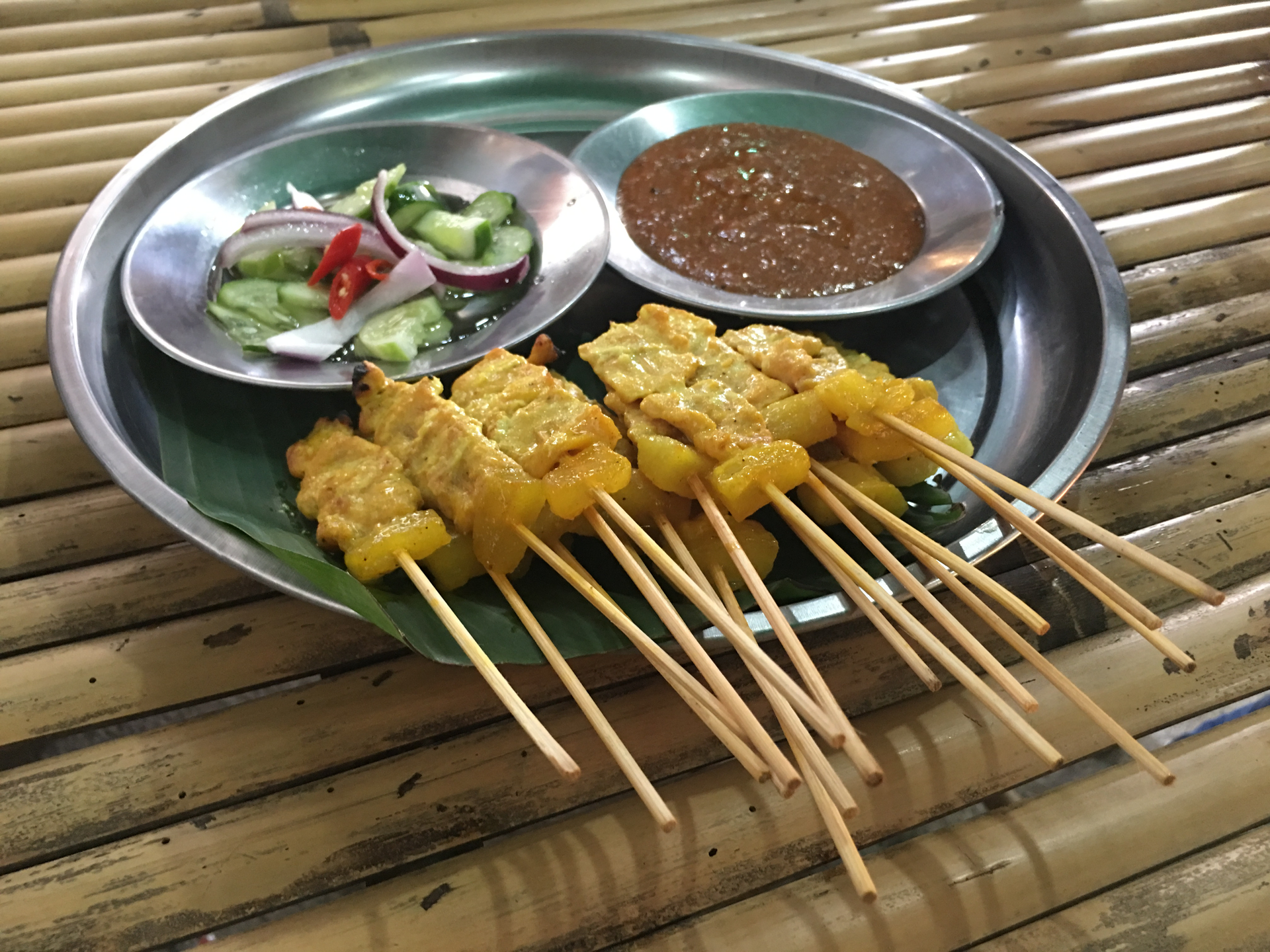 Overhead flat-lay of all ingredients for Vietnamese Lemongrass Tempeh Skewers with Pineapple Dipping Sauce laid out on a kitchen surface.