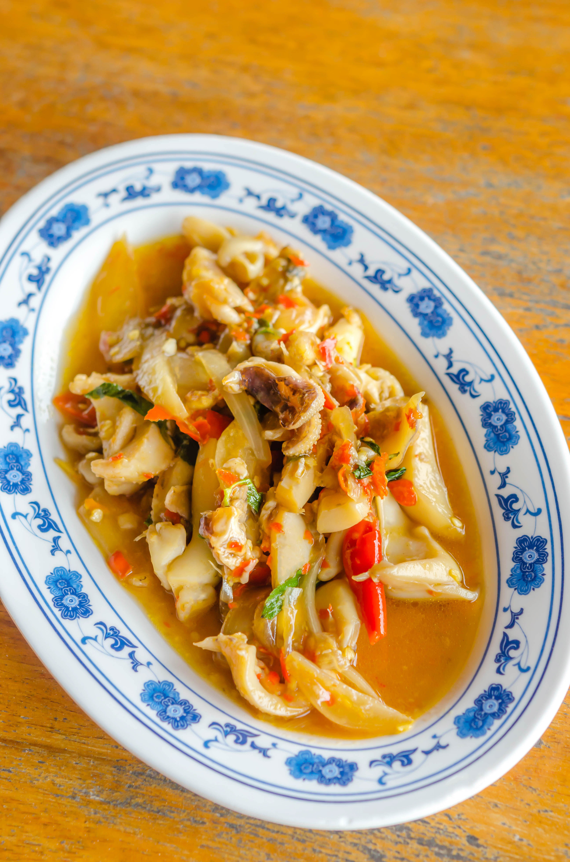 Overhead flat-lay of all ingredients for Vietnamese Starfruit and Ginger Chicken Stew laid out on a kitchen surface.