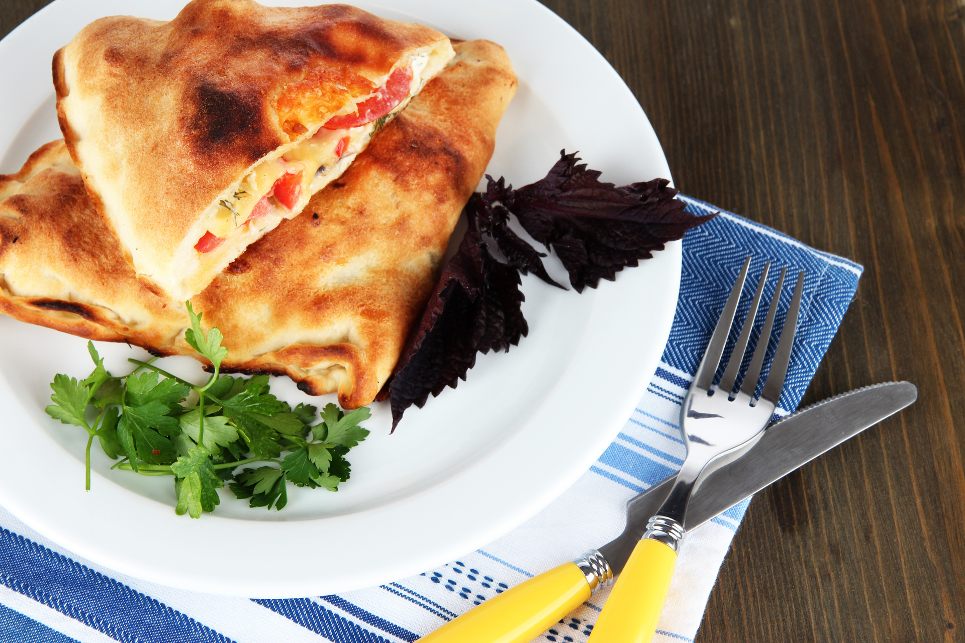 Overhead flat-lay of all ingredients for Warm Serbian Ajvar Flatbread with Grated Cheese laid out on a kitchen surface.