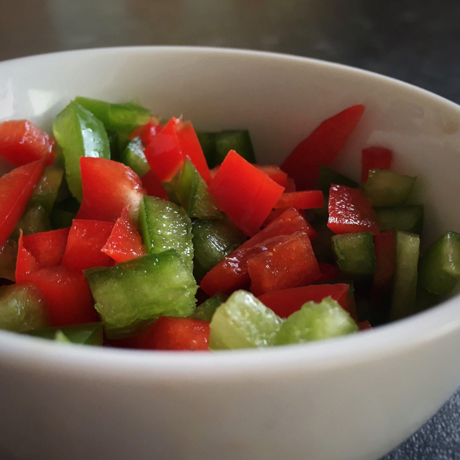 Overhead flat-lay of all ingredients for Zesty Andalusian Pipirrana Salad with Fresh Tomato and Cucumber laid out on a kitchen surface.