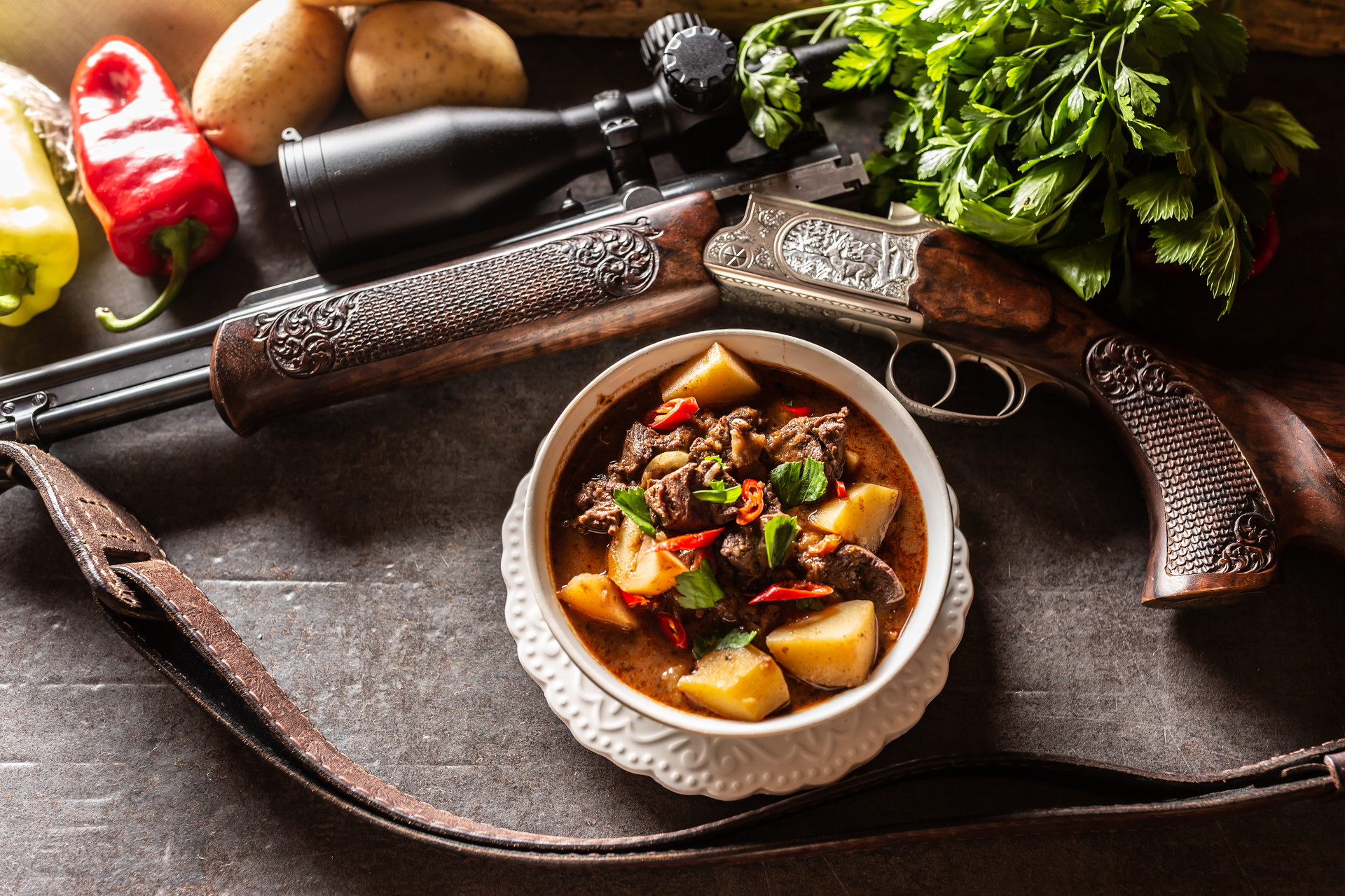 Overhead flat-lay of all ingredients for Zesty Croatian Čobanac Stew laid out on a kitchen surface.