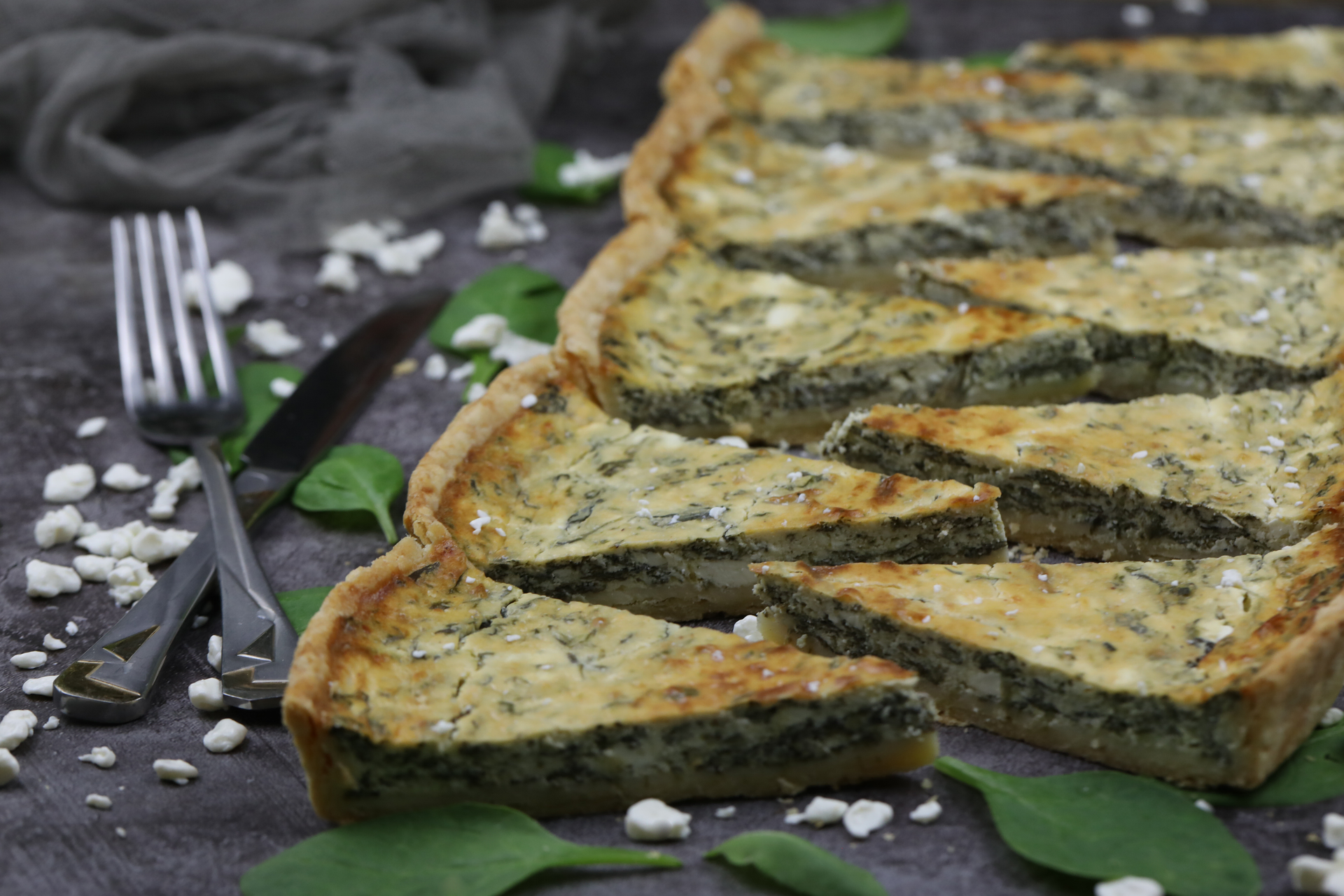 Overhead flat-lay of all ingredients for Zesty Croatian Soparnik with Swiss Chard and Garlic laid out on a kitchen surface.