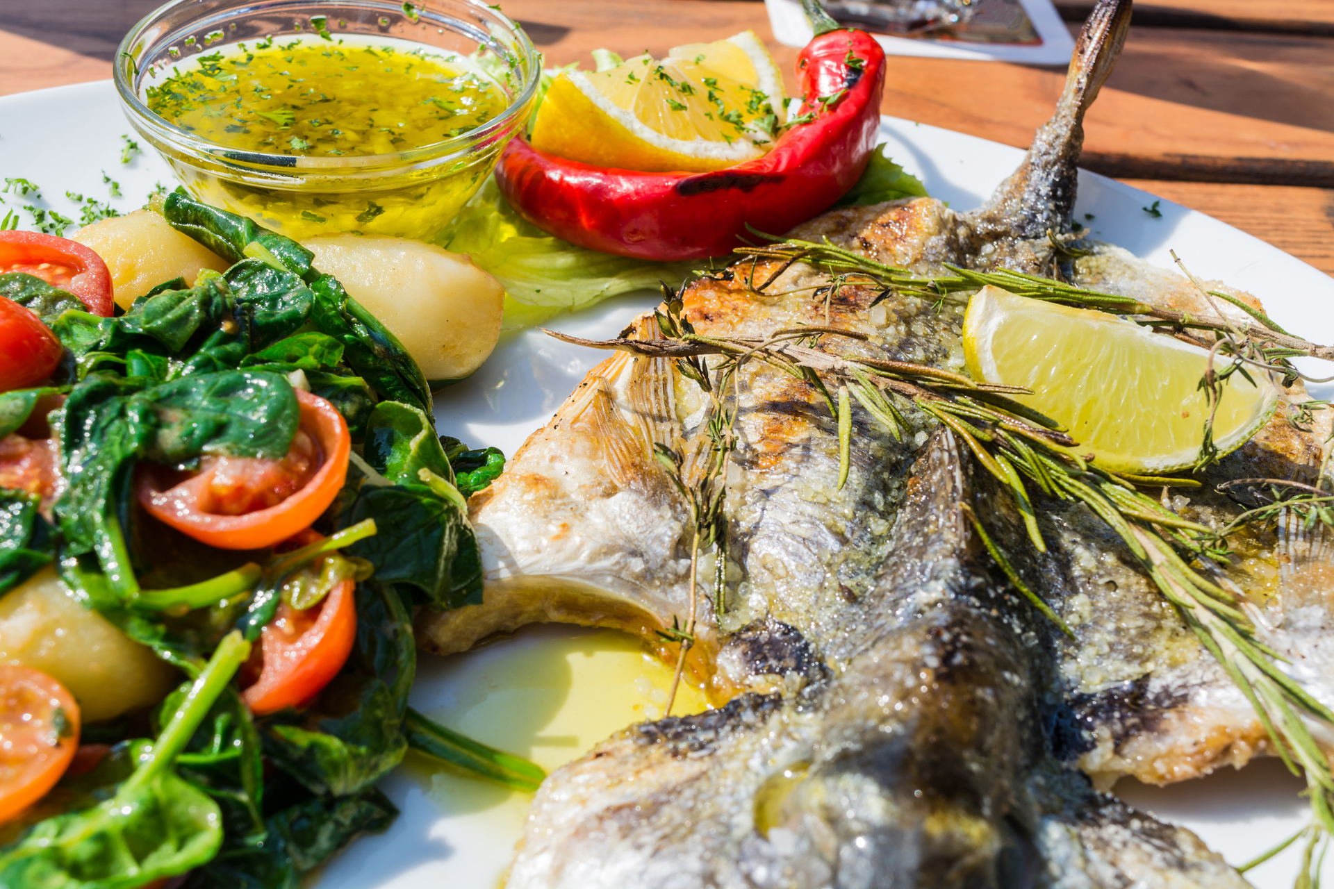 Overhead flat-lay of all ingredients for Zesty Egyptian Feseekh with Fermented Fish and Lemon laid out on a kitchen surface.