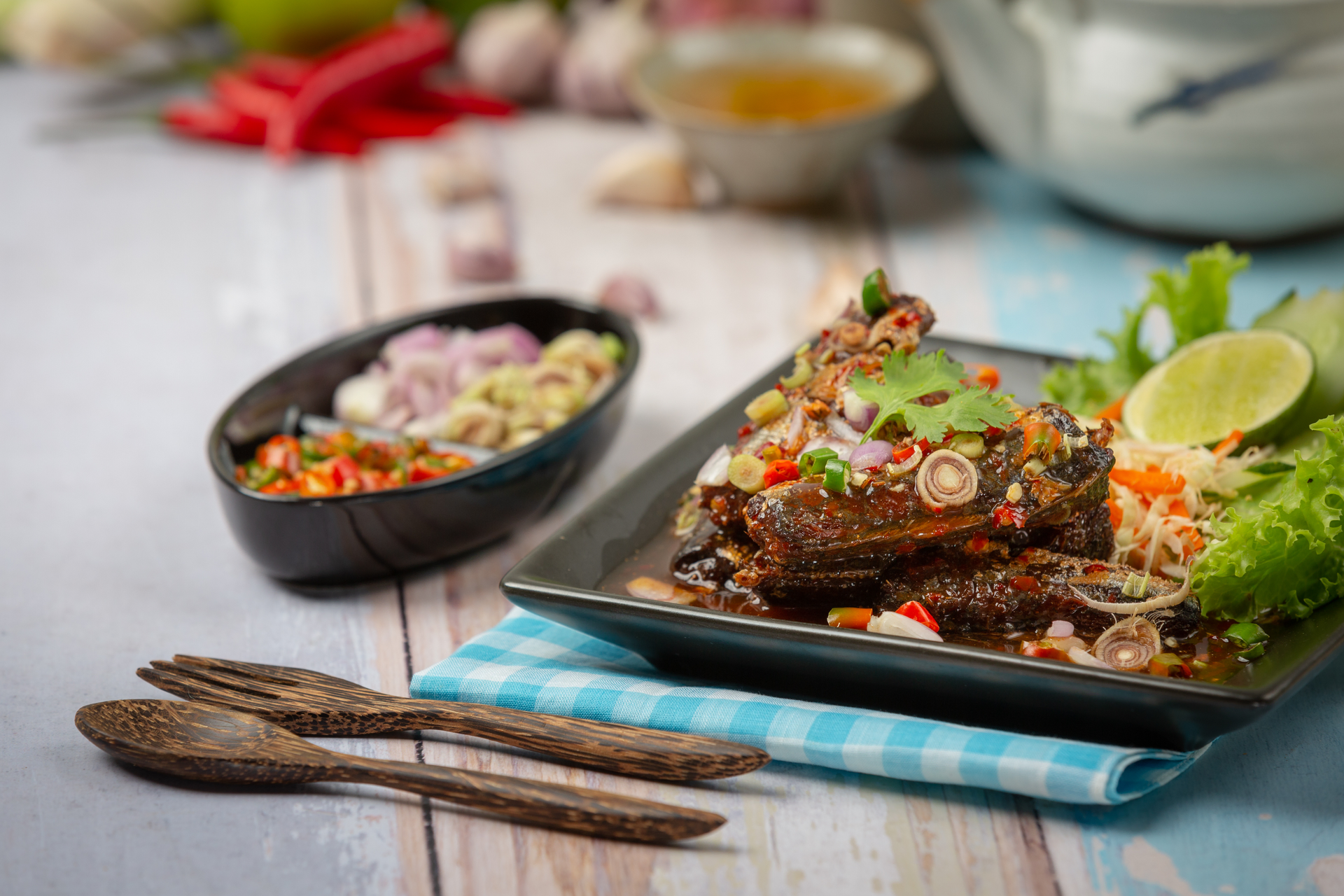 Overhead flat-lay of all ingredients for Zesty Filipino Sinugba with Spiced Vinegar Marinade laid out on a kitchen surface.