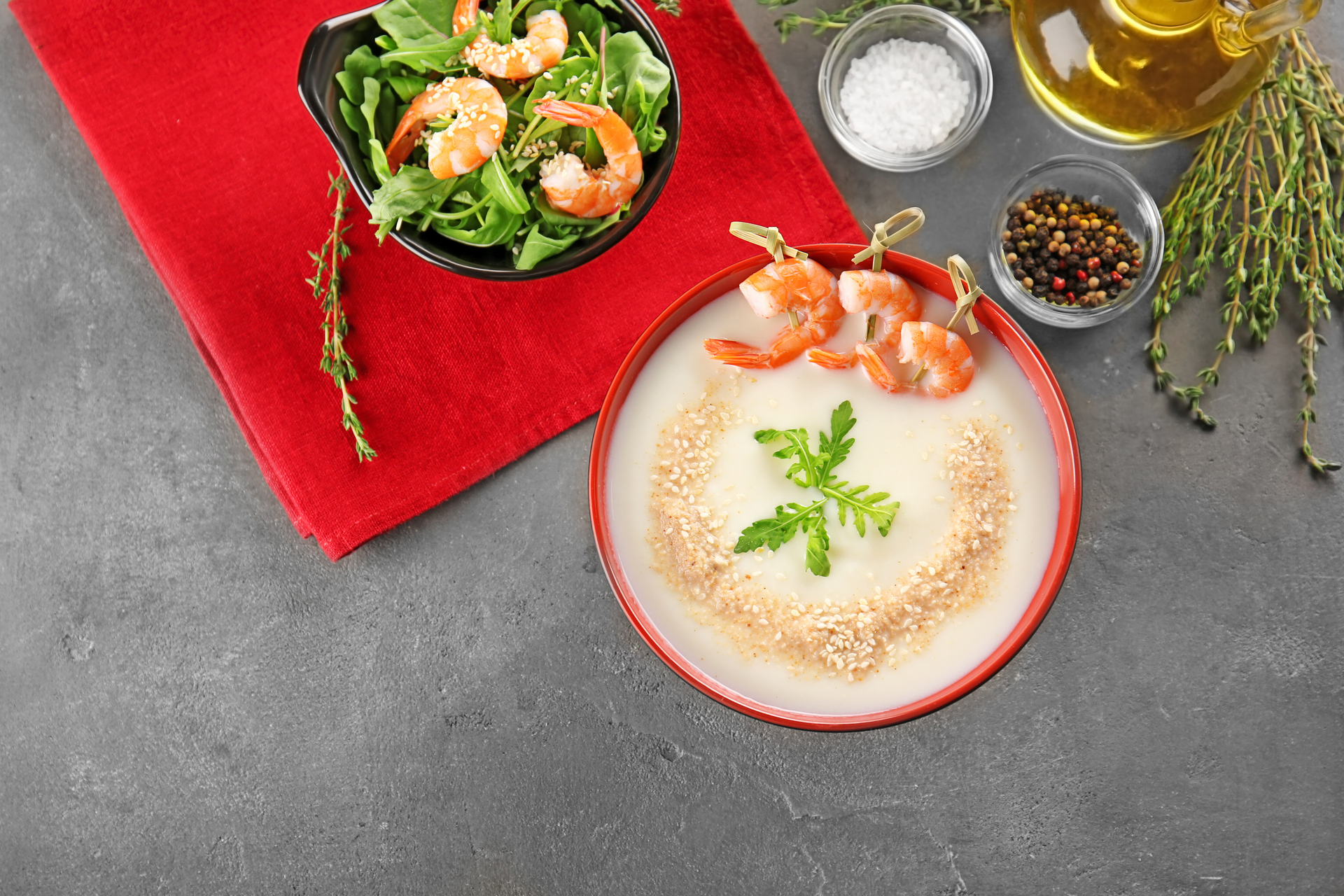 Overhead flat-lay of all ingredients for Zesty Greek Avgolemono Soup with Lemon and Orzo laid out on a kitchen surface.