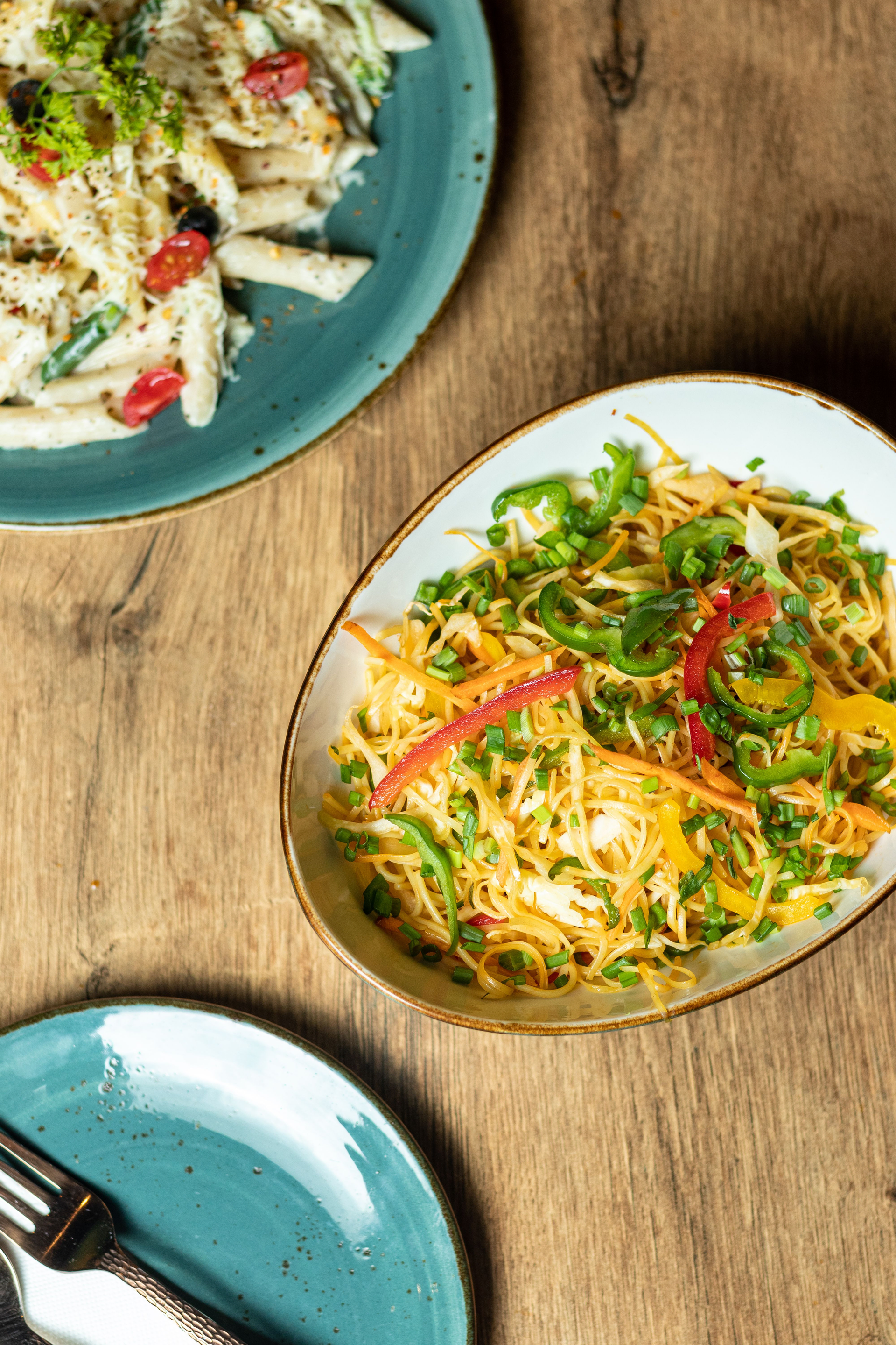 Overhead flat-lay of all ingredients for Zesty Indian Curry-Infused Spaghetti Aglio e Olio laid out on a kitchen surface.