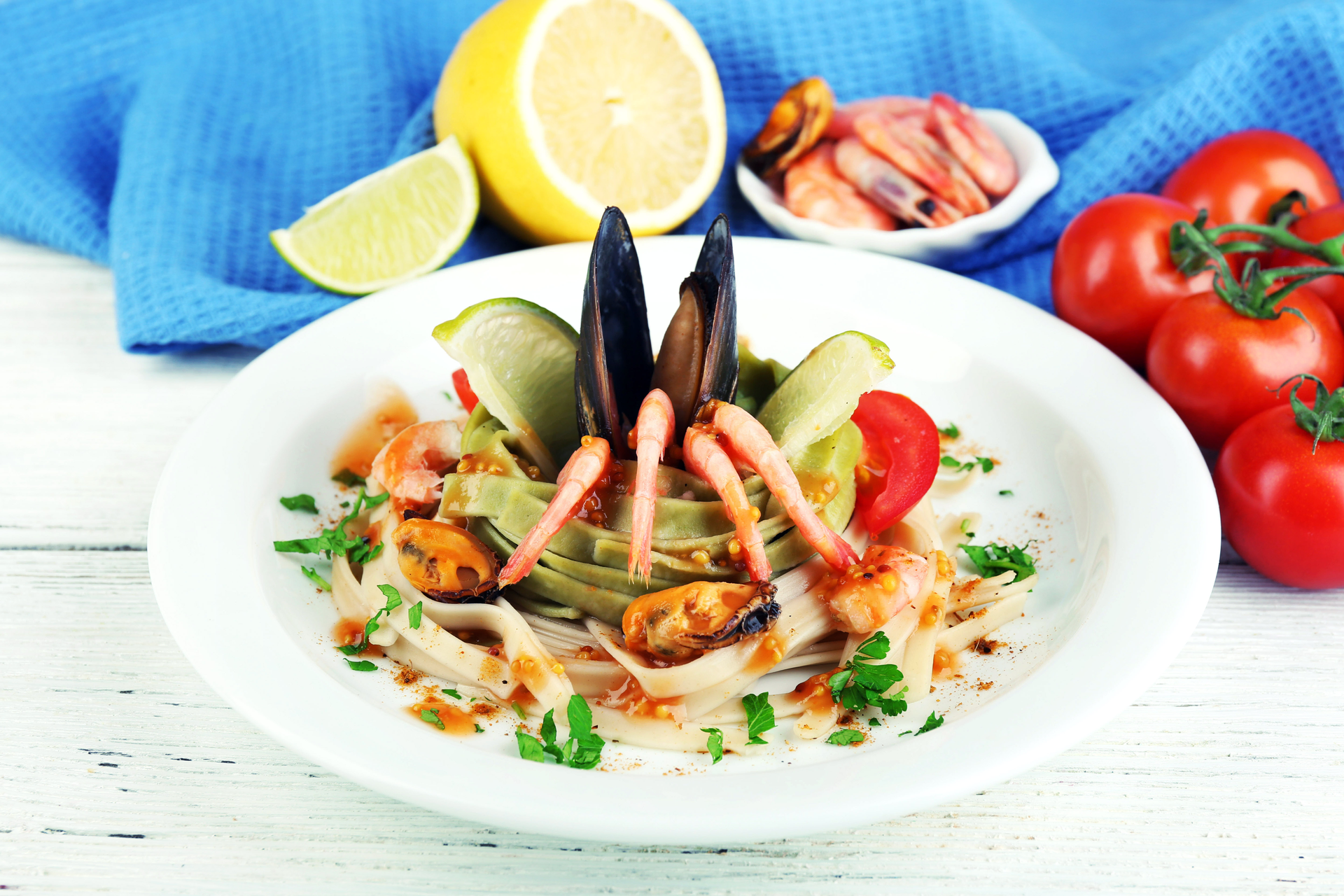 Overhead flat-lay of all ingredients for Zesty Italian Cacciucco with Mixed Seafood laid out on a kitchen surface.