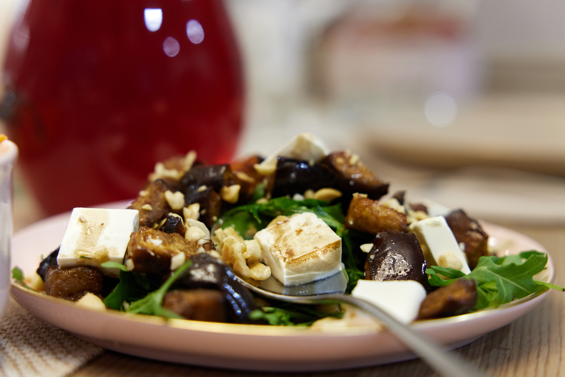 Overhead flat-lay of all ingredients for Zesty Italian Caponata with Ricotta Salata and Pine Nuts laid out on a kitchen surface.