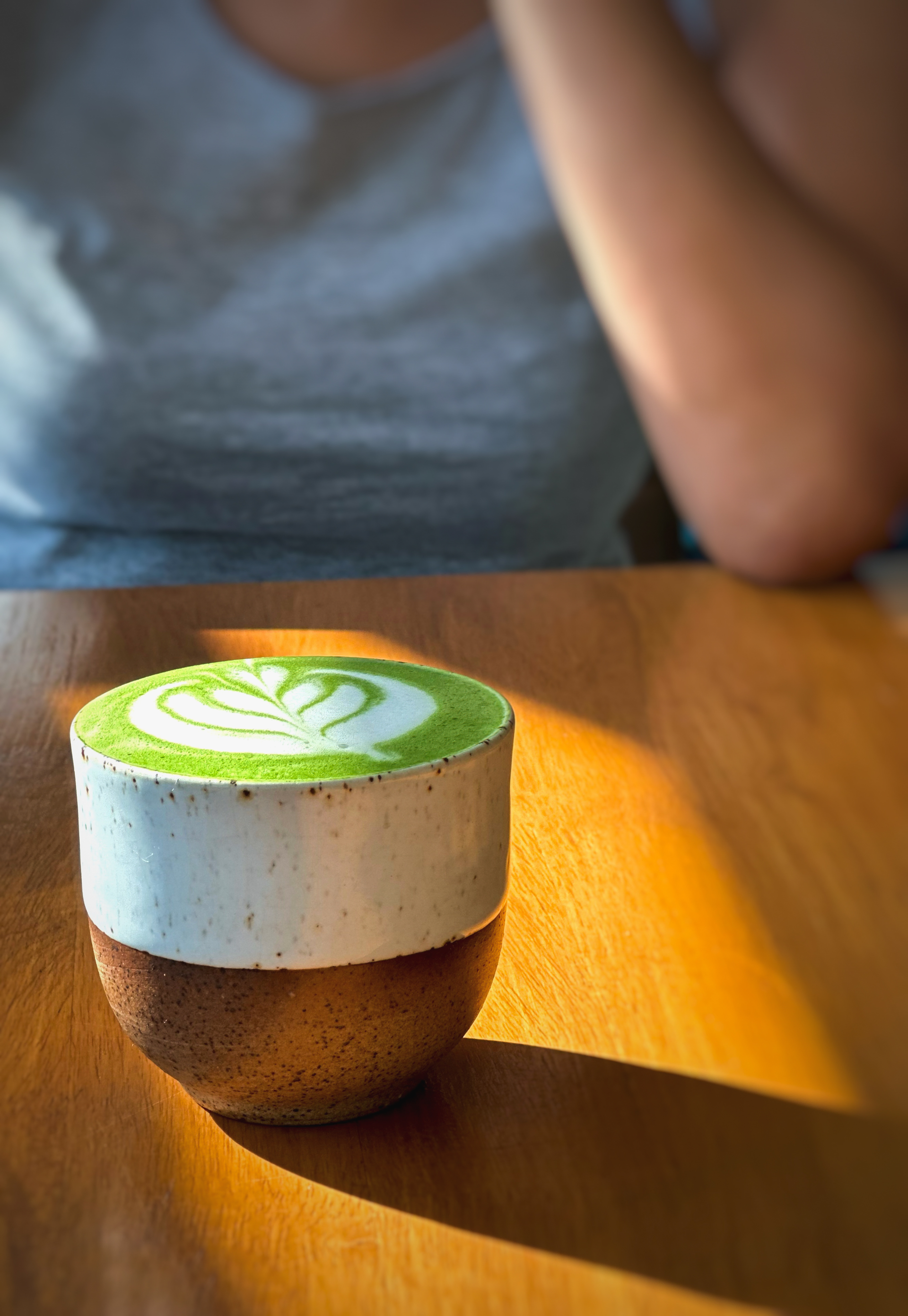 Zesty Japanese Matcha Latte with Sweet Azuki Beans — Beverage served and photographed from above