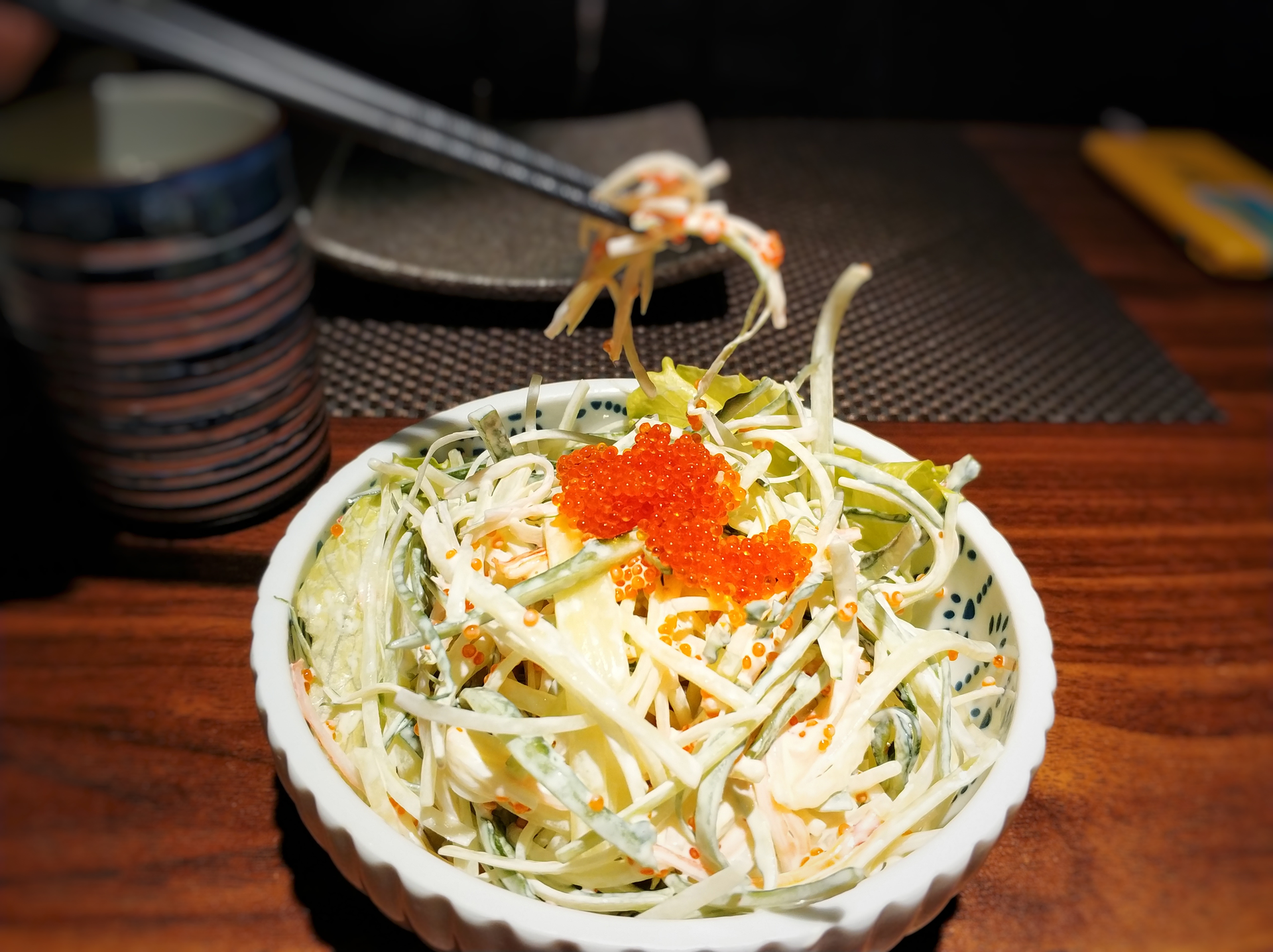 Overhead flat-lay of all ingredients for Zesty Japanese Yuzu-Wasabi Slaw with Fresh Vegetables laid out on a kitchen surface.