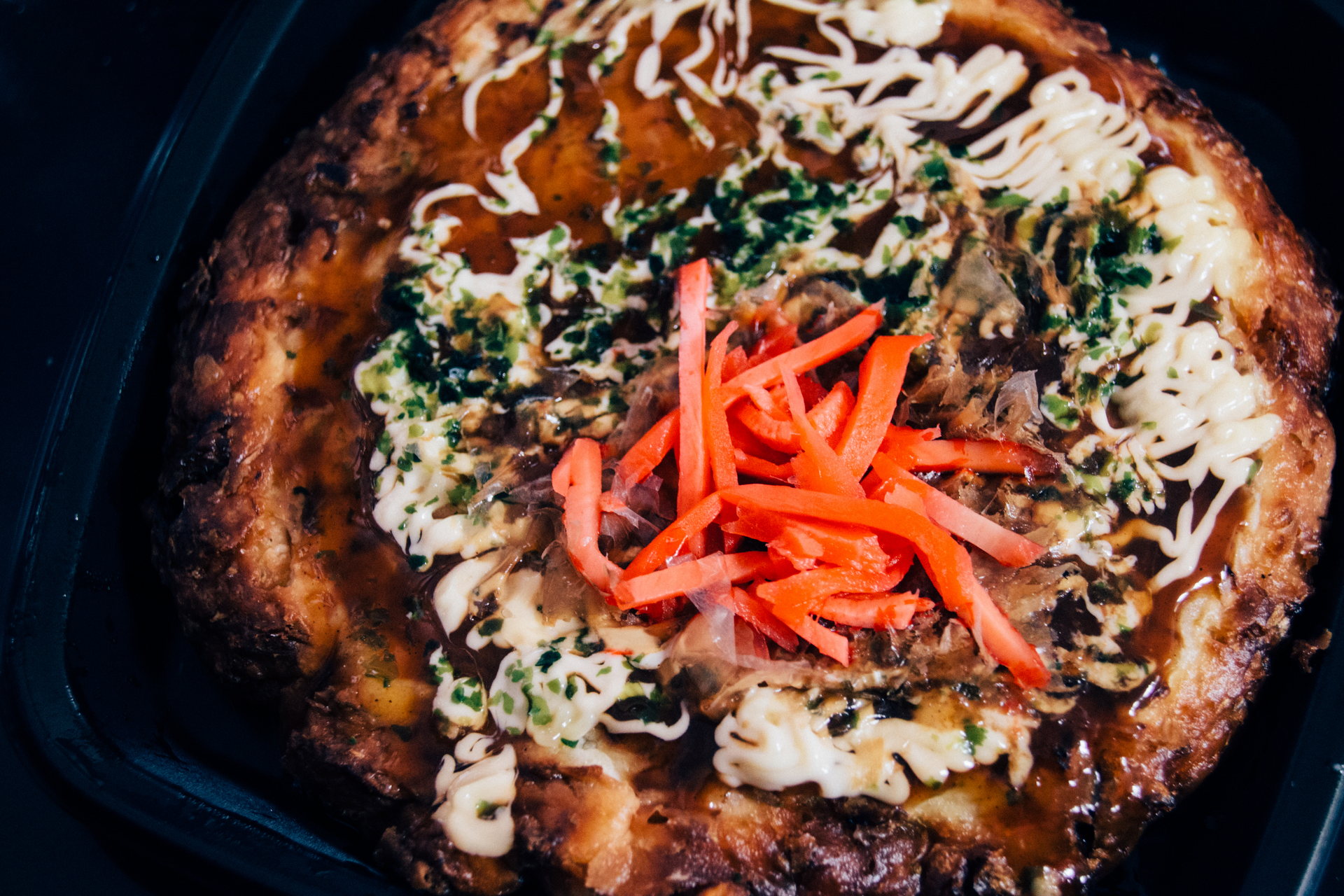Overhead flat-lay of all ingredients for Zesty Korean Kimchi Cheese Pizza with Scallions laid out on a kitchen surface.