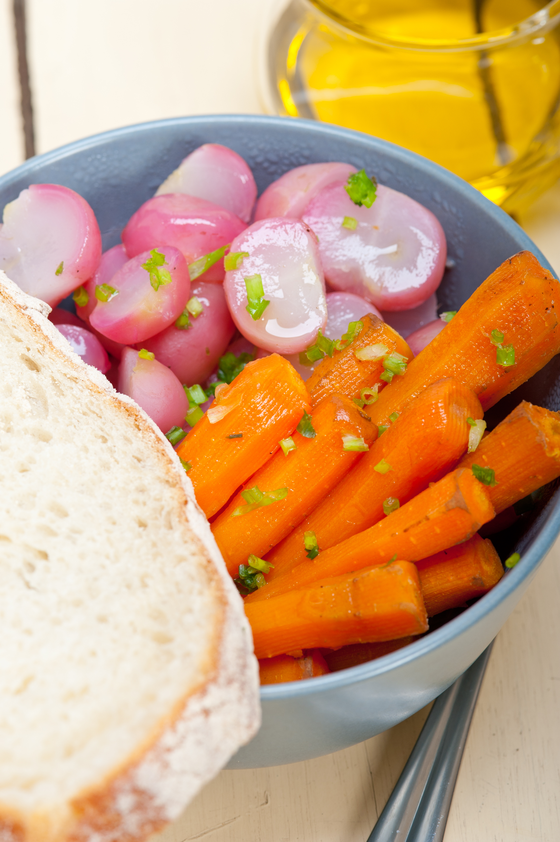 Overhead flat-lay of all ingredients for Zesty Moroccan Chermoula Carrots with Lemon and Garlic laid out on a kitchen surface.