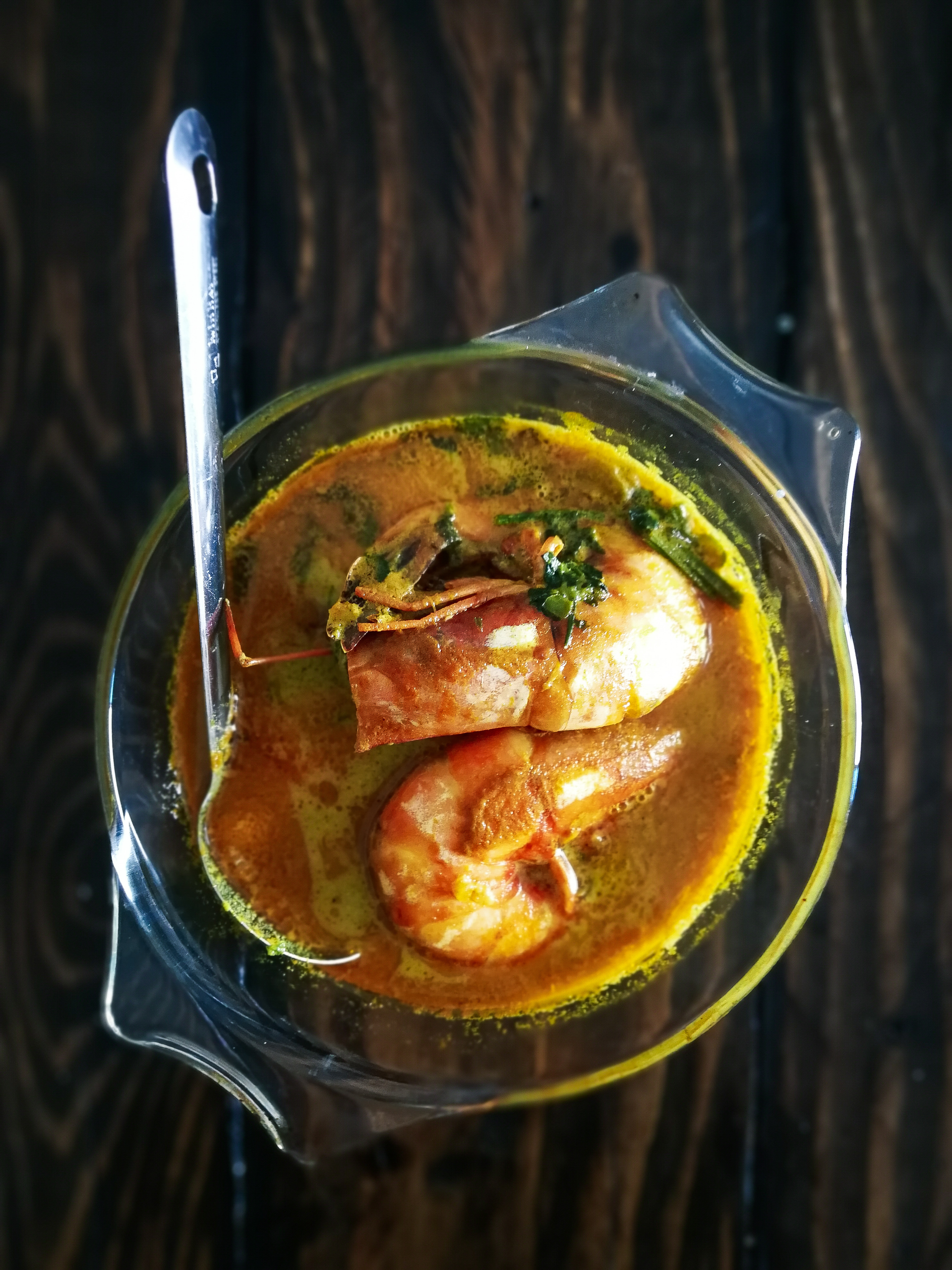 Overhead flat-lay of all ingredients for Zesty Portuguese Caldo de Peixe with Garlic Broth and Lemon laid out on a kitchen surface.