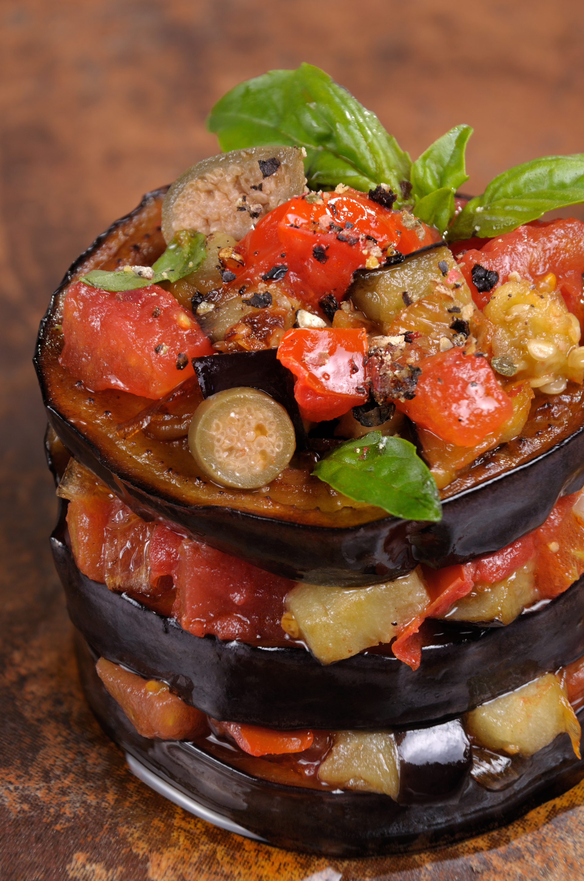 Overhead flat-lay of all ingredients for Zesty Sicilian Caponata with Balsamic Glaze laid out on a kitchen surface.