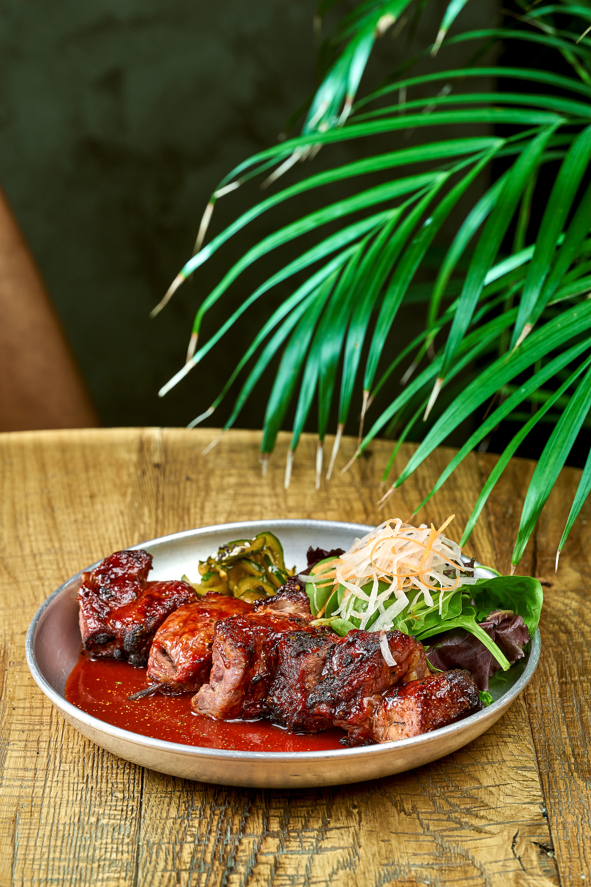 Overhead flat-lay of all ingredients for Zimbabwean Nyama Choma with Tomato-Scallion Salsa laid out on a kitchen surface.