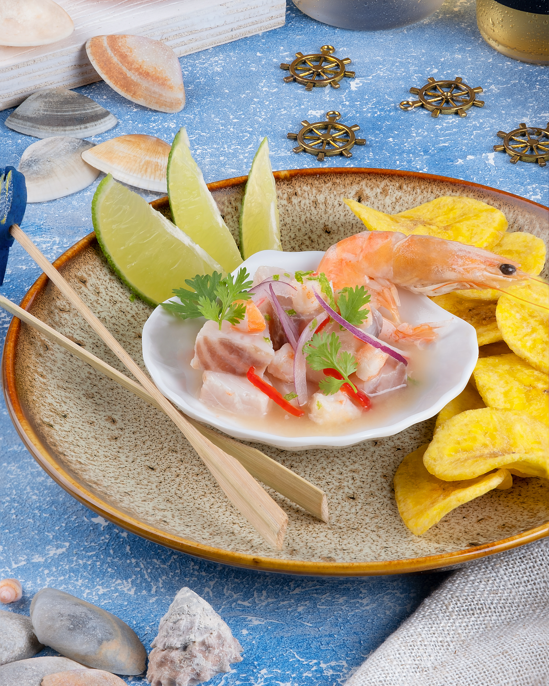 Overhead flat-lay of all ingredients for Peruvian ceviche with authentic leche de tigre recipe laid out on a kitchen surface.